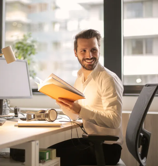 Office worker reviewing documents at a desk